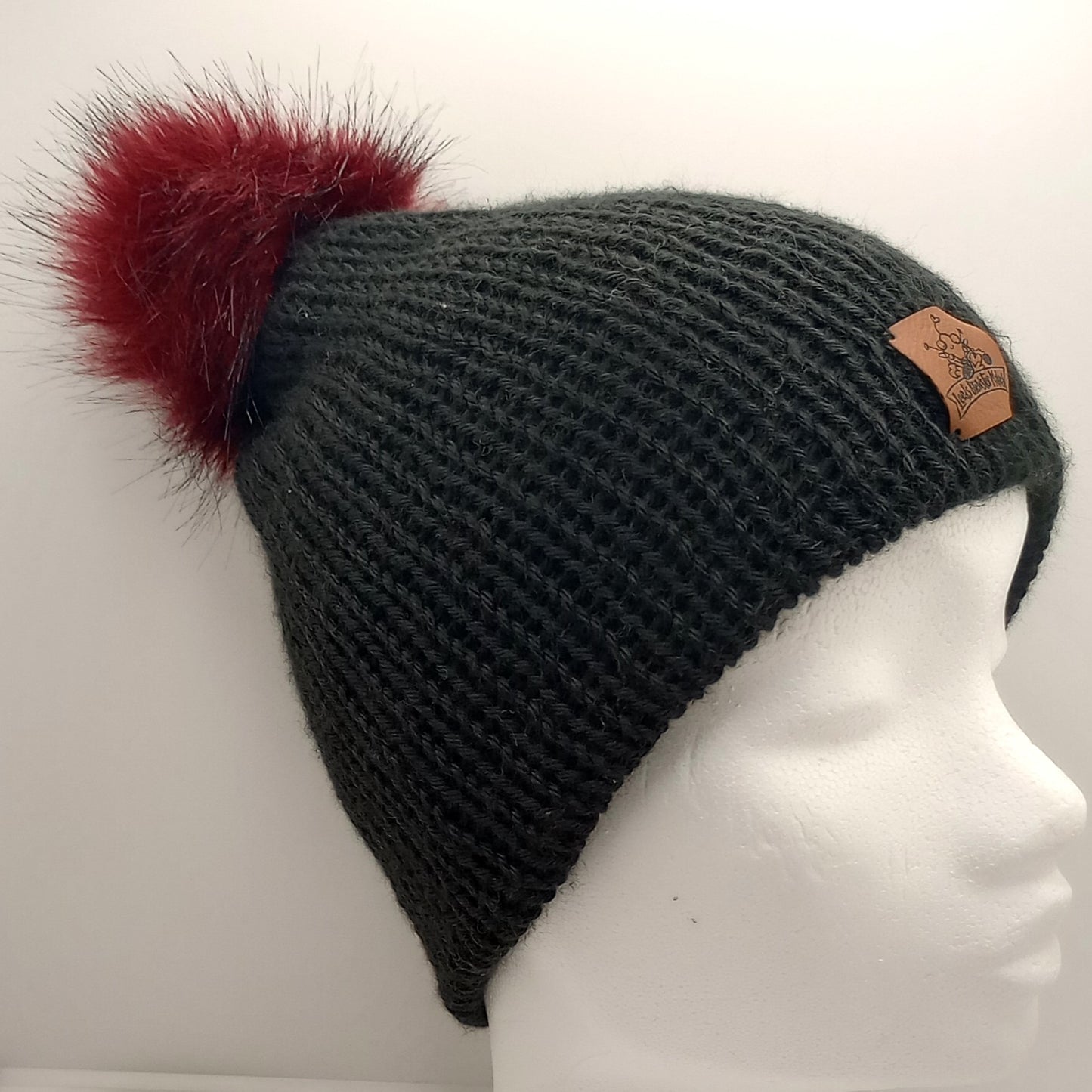 Adult Knitted black hat with a Red Pompom