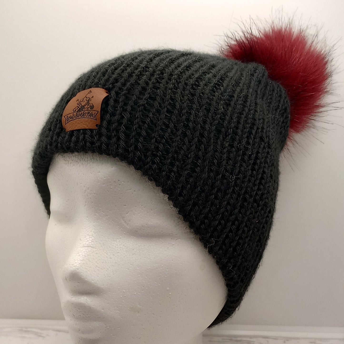 Adult Knitted black hat with a Red Pompom