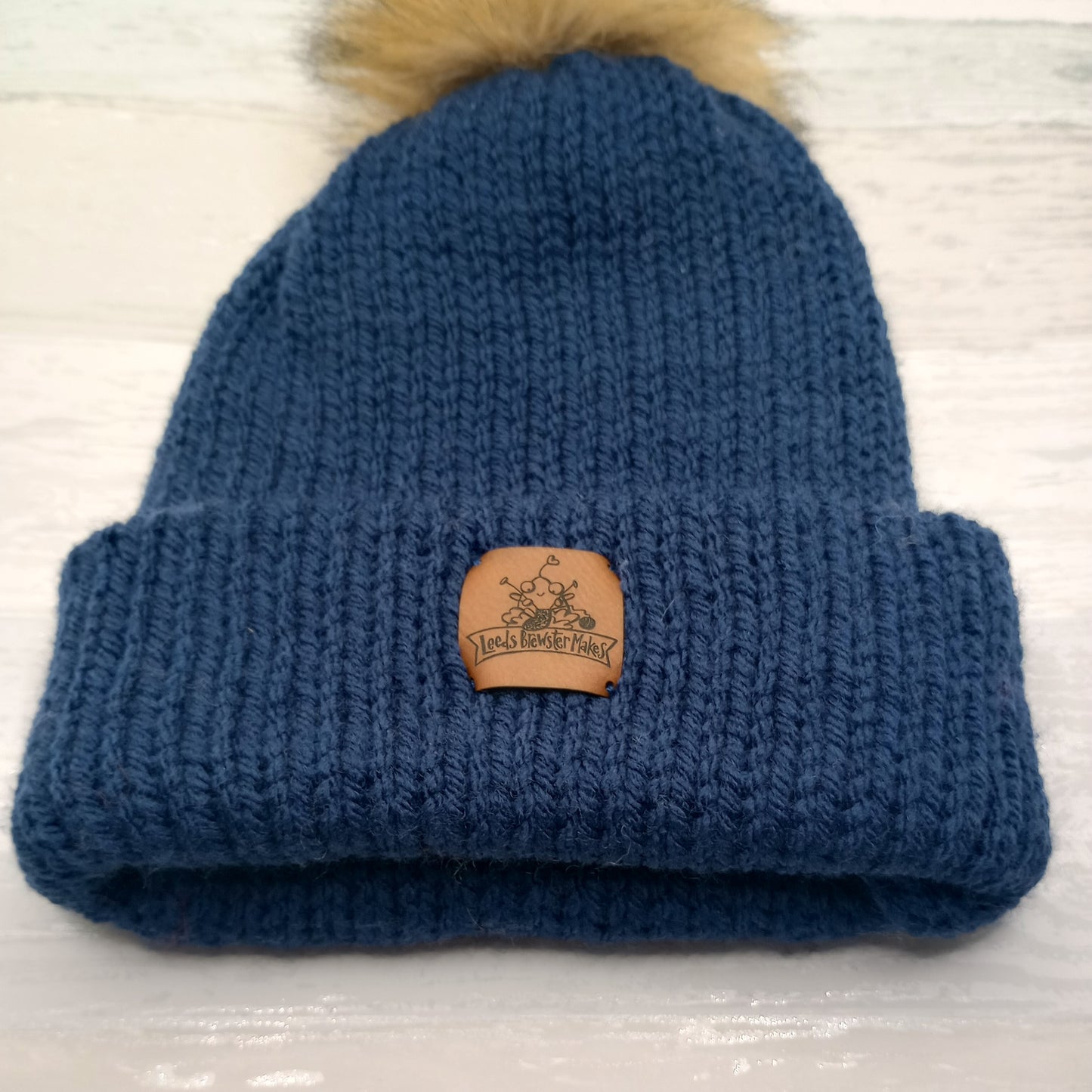 Knitted Navy Hat with a Pompom